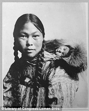 Eskimo mother with child on back