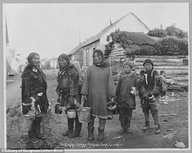 Agriculture: Berry pickers composed of three women and two boys pose holding pails