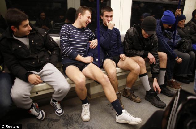 Hilarious: A group of men share a laugh as they take part in No Pants Day in Sofia, Bulgaria