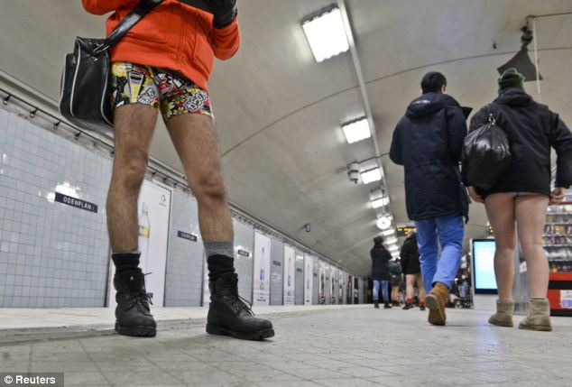 Undressed to impress: One commuter with a particularly loud pair of pants stands on the platform of a station in Stockholm 
