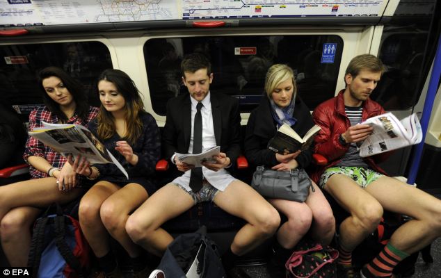 Flashmob: A group of Tube passengers pretend not to know each other and keep a straight face as they take part in No Trousers on the Tube 2013 