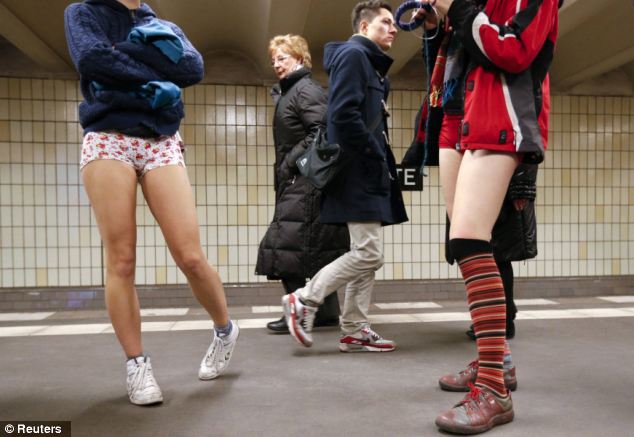 Colourful: Some dressed in garish underwear as they removed their trousers to take part in the No pants Subway Ride in Berlin today