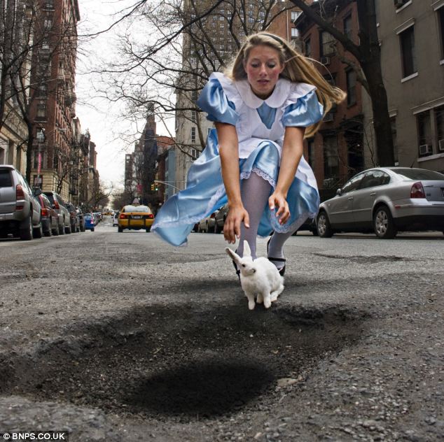 Alice in Wonderland chases after a rabbit which is about to jump into a very large black hole