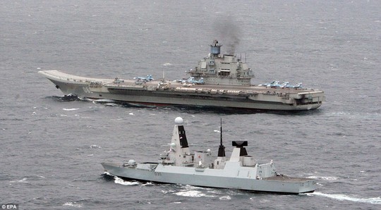 Escort: HMS Dragon (foreground) with the Russian aircraft carrier Admiral Kuznetsov, in the English Channel. HMS Dragon tracked and met up with a Russian task group off the coast of Brest as they entered the English Channel yesterday