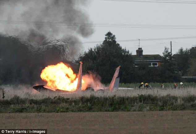 Flames: The crash took place in an isolated rural area and no premises have been affected, police said