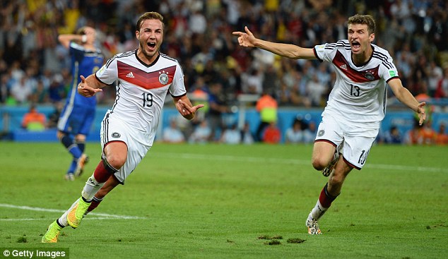 Winners: Mario Gotze (left) and Thomas Muller celebrate the substitutes crucial goal