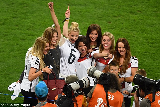 The WAG group photo: Partners of the Germany team took to the pitch to celebrate their World Cup win