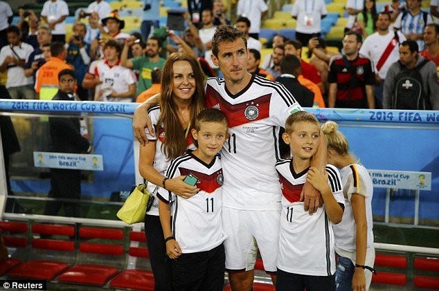 Family outing: Miroslav Klose and his wife Sylwia with their children after Germany won the World Cup