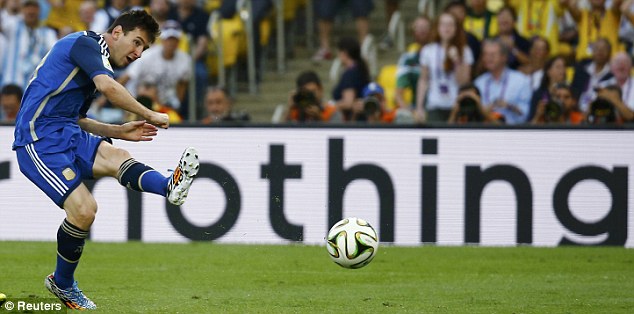 Taking aim: Messi strikes the ball towards goal with his trusty left foot