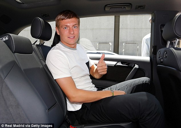 Kroos control: The midfielder arrives at Barajas airport before his official unveiling as a new Real Madrid player