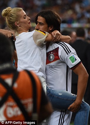 Hug: Sami Khedira is greeted by his partner Lena Gercke
