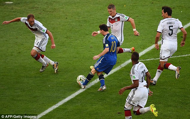 Crowd scene: The Germany players get around Messi in an attempt to restrict his space