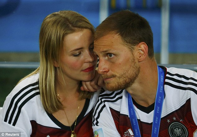 Intimate: Benedikt Howedes shares a moment with his girlfriend Lise Wesseler after Germany triumphed