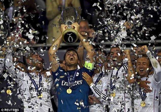 Sparkle: Confetti is released into the air as Casillas lifts the Super Cup