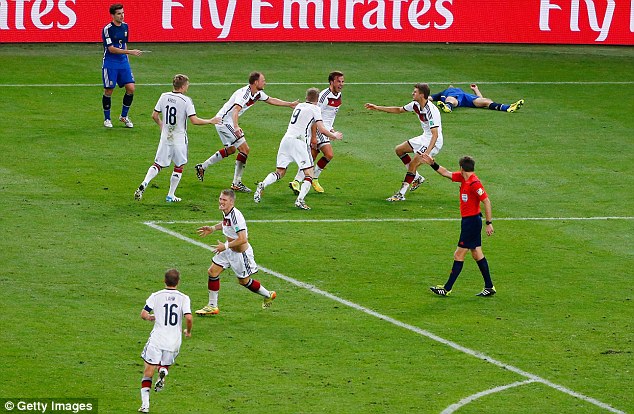 Joy and despair: The Germany players go wild after the goal but the Argentines are out on their feet