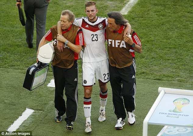 Off night: Kramer looks despondent as he is helped down the tunnel after half an hour