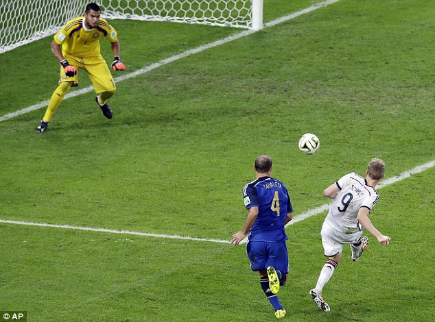 Going the extra mile: Andre Schurrle (right) has a shot saved right at the start of extra-time
