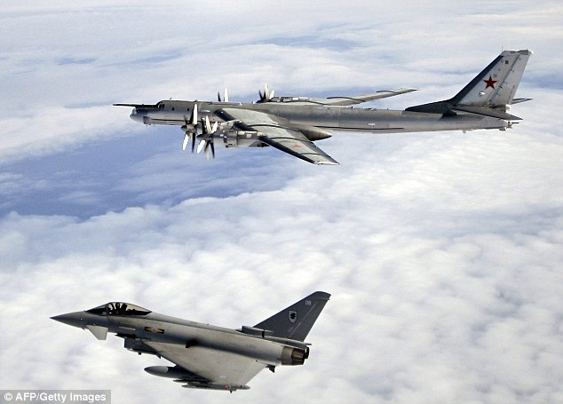 An RAF Typhoon aircraft from Number XI Squadron shadows a Russian Bear-H aircraft (file picture)
