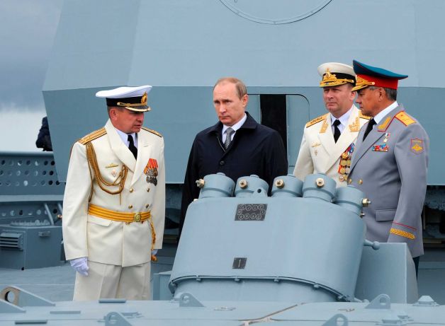 Russian President Vladimir Putin, second left, and Defense Minister Sergei Shoigu, right, with a group of Russian naval officers during a Navy parade in Baltiisk, western Russia, Sunday, July  26, 2015 during celebrations for Russian Navy Day. (Mikhail Klimentyev/RIA-Novosti, Kremlin Pool Photo via AP) Photo: Mikhail Klimentyev, AP / POOL RIA NOVOSTI KREMLIN