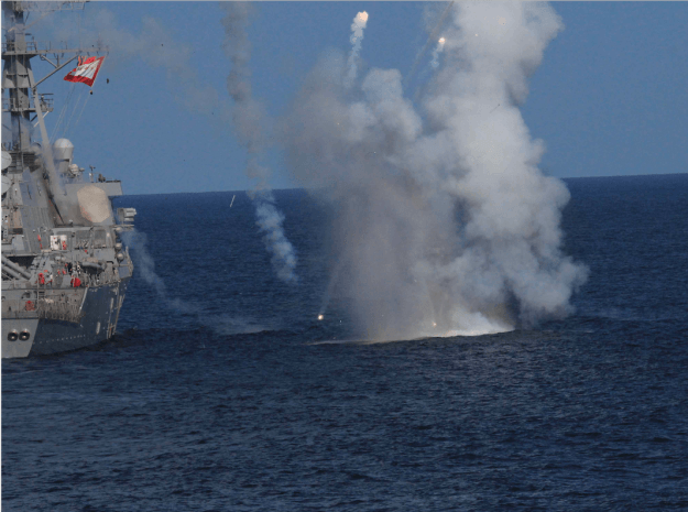 A Raytheon SM-2 Block IIIA guided missile explodes over USS The Sullivans during a training exercise on July 18, 2015. US Navy Photo obtained by USNI News