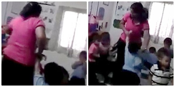
Người giáo viên kéo lê một em bé khoảng 4 tuổi vào góc lớp.
