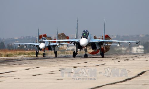 Máy bay Sukhoi SU-24 của Nga tại căn cứ không quân Hmeimim ở tỉnh Latakia, Syria ngày 3/10. Ảnh: AFP/TTXVN