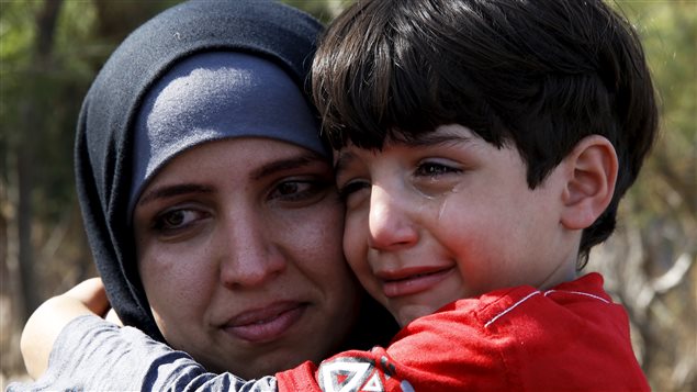 Tại sao người ta lại đánh nhau ở Syria hả mẹ? Ảnh: Reuters