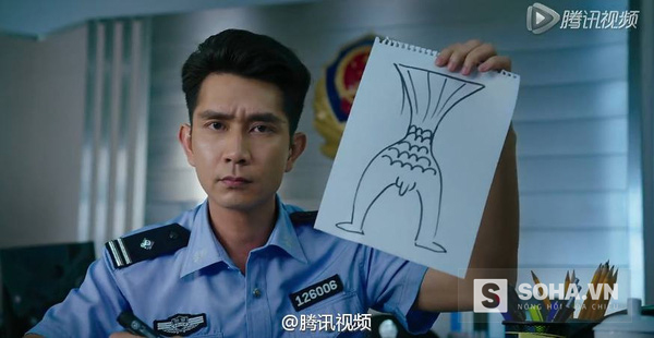 
Viên cảnh sát đang cố gắng phác họa chân dung người cá đã bắt cóc Lưu Hiên.
