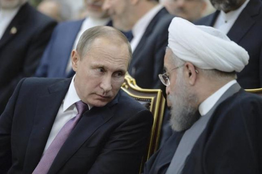Hai Tổng thống Putin (trái) và Rouhani. Ảnh: Reuters