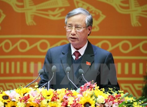 Đồng chí Trần Quốc Vượng, Trưởng đoàn Thư ký Đại hội đọc Dự thảo Nghị quyết Đại hội XII Đảng Cộng sản Việt Nam. (Nguồn: TTXVN)