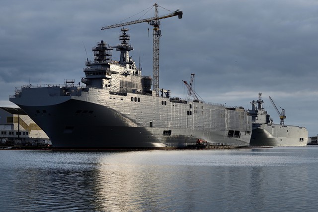 Sevastopol (L) and the Vladivostok warships, two Mistral class LHD amphibious vessels ordered by Russia from STX France in Saint-Nazaire, western France, on December 20, 2014