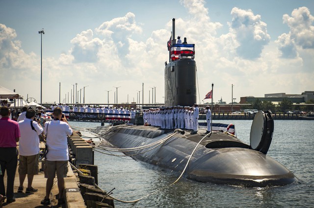 NORFOLK, Va. (Aug. 1, 2015) Sailors man the rails as they bring the ship to life during the commissioning ceremony for the Virginia-class attack submarine USS John Warner (SSN 785) at Naval Station Norfolk. John Warner is the 12th Virginia-class attack submarine to join the fleet and the first Virginia-class attack submarine to be homeported in Norfolk, Va. (U.S. Navy photo by Mass Communication Specialist Seaman Casey Hopkins/Released)
