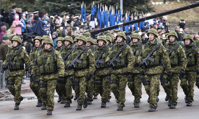 Estonian troops parade in Tallinn, Estonia, Tuesday, Feb. 24, 2014. People are celebrating Independence Day in Tallinn, Estonia. (AP Photo/Liis Treimann)