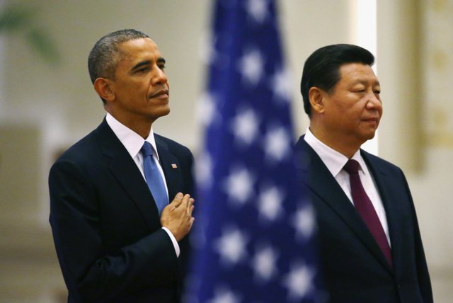 Tổng thống Mỹ Barack Obama (trái) và Chủ tịch Trung Quốc Tập Cận Bình tại Diễn đàn APEC 2014 ở Bắc Kinh. Ảnh: Reuters.