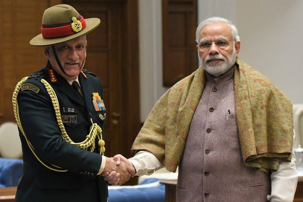 Mr. Rawat (left) and Prime Minister Modi