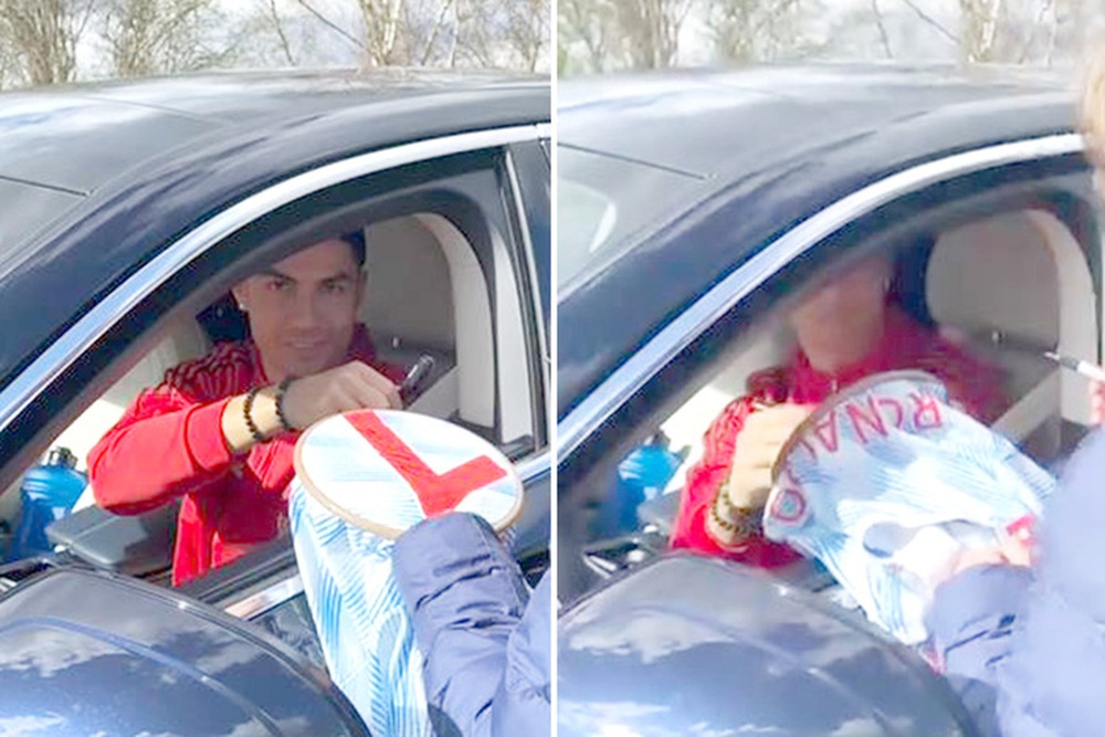 Ronaldo vẫn vui vẻ k&yacute; tặng fan nh&iacute; trước khi đổ bệnh khiến MU l&acirc;m nguy - Ảnh 1.