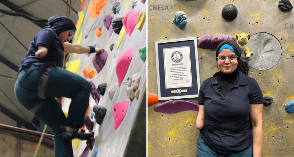 The woman who lost an arm tried to climb the 396-meter-high wall, setting a record - Photo 1.