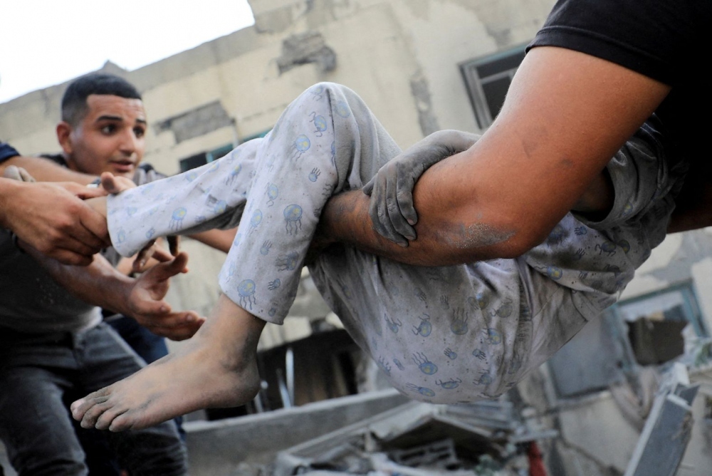 Những hình ảnh kinh hoàng về cuộc chiến giữa Israel và Hamas - Ảnh 13.
