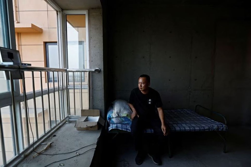 Nỗi khổ của những người lỡ mua chung cư xây dở dang ở Trung Quốc - Ảnh 2.