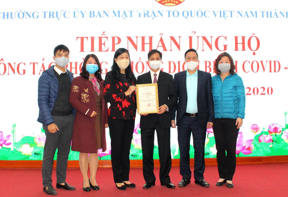 Tiếp nhận tiền và hiện vật hỗ trợ phòng, chống dịch Covid-19 - Ảnh 1.
