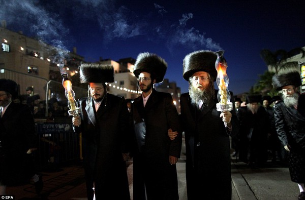 Future leader: The groom Shalom Rokeach, 18, pictured centre, is the grandson of the head of one of the largest hasisic communities in Jerusalem, Beltz Rebbe, and is expected to take his place one day