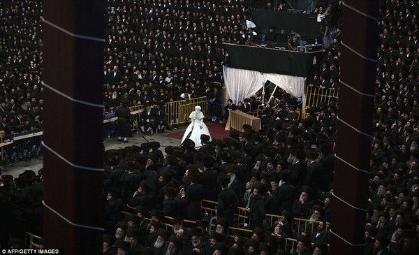 Centre of attention: The bride Hannah Batya Penet takes part in the Mitvah tantz ritual where honoured rabbis dance in front of her 