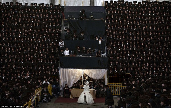 Tens of thousands of Ultra-Orthodox Jews of the Belz Hasidic Dynasty watch the wedding ceremony of Rabbi Shalom Rokach