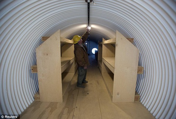 Dommsday: Paul Seyfried works in a bunker he is constructing for a client at Utah Shelter Systems in North Salt Lake, Utah. The price of the shelters range from $51,800 to $64,900