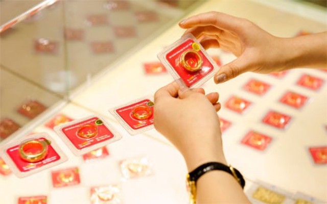 Phong tục mua vàng ngày vía Thần Tài: Chọn con số phát lộc - Ảnh 2. Phong tục mua vàng ngày vía Thần Tài: Chọn con số phát lộc - Ảnh 2.