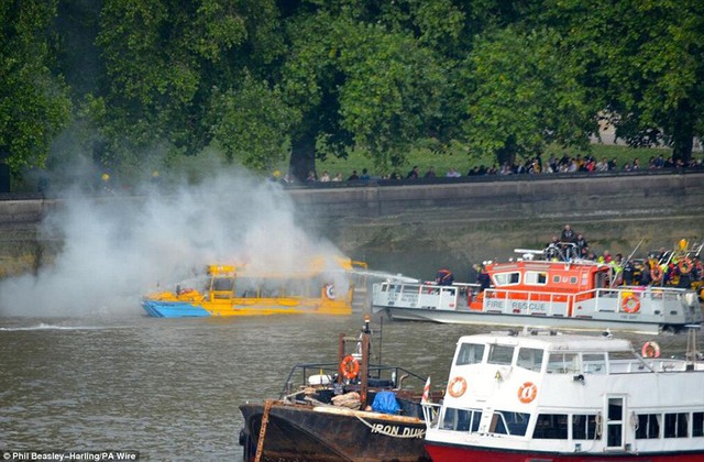 Watching: A photo from Phil Beasley-Harling of a rescue services attending to London Duck Tours vessel, which caught fire on a stretch of the River Thames close