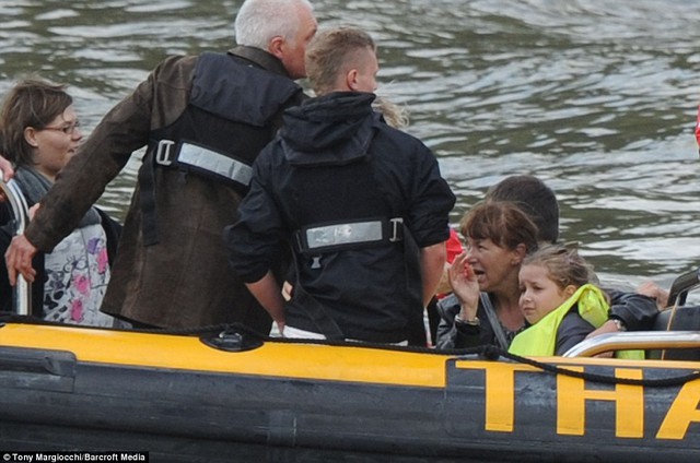 Shock: Passengers rescued from the smoking London Duck Tours amphibious vehicle on the River Thames, close to Lambeth Bridge in Central London