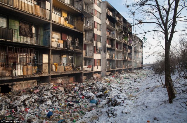 Horrifying: Piles of fifthly rubbish can be seen strewn all over the floor outside a high-rise apartment. More debris and dirty washing can also be seen hanging outside many of the flats where many Roma children live