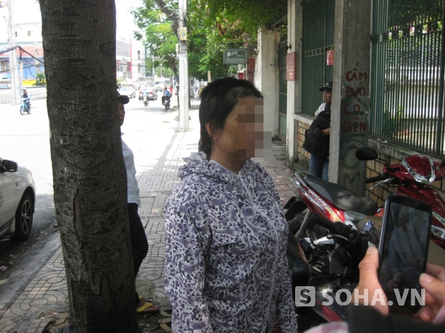 Bà Nguyễn Thi T. với đầu tóc bị cắt trụ