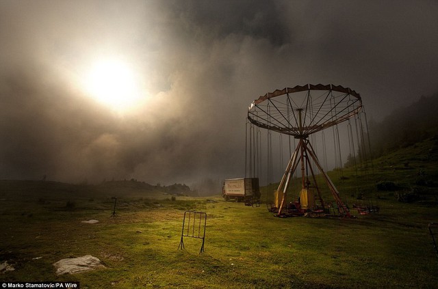 Carousel in the mist, in Prokoshko, Bosnia taken by finalist Marko Stamatovic, from Kragujevac, Serbia